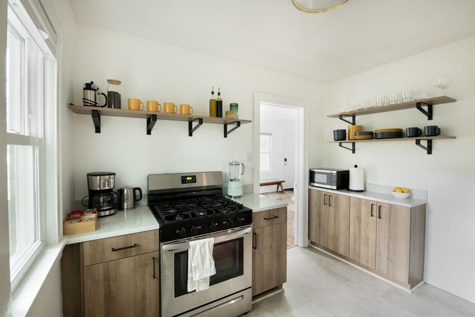 Cook and enjoy the fully stocked kitchen, stainless steel appliances, and a lovely little coffee bar.