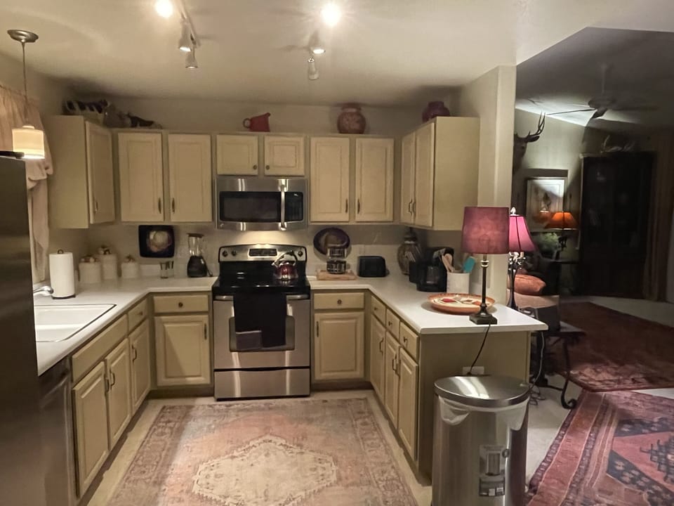 Fully stocked kitchen with stainless steel appliances 