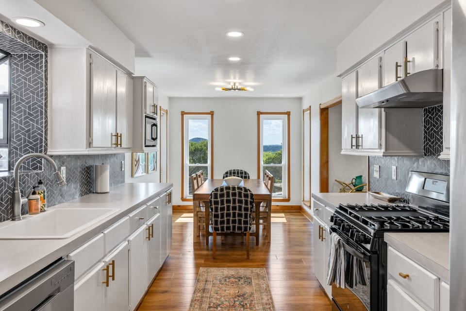 Kitchen and dining room with seating for eight. 
