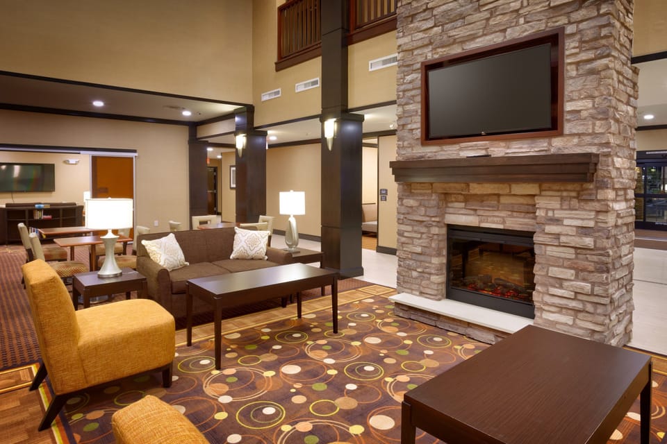 Common lounge with comfortable seating and fireplace.