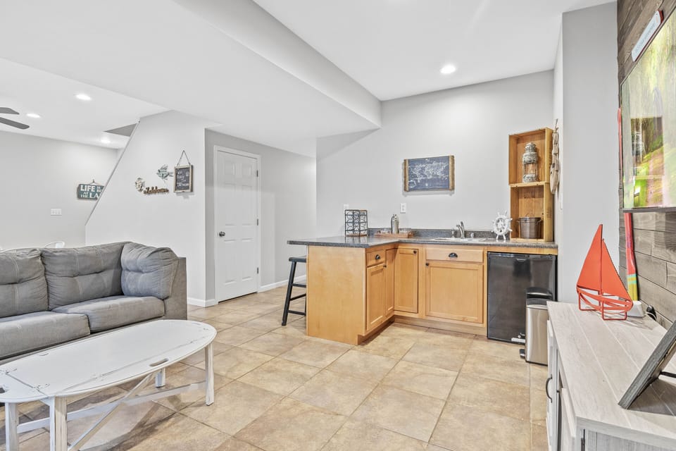 lower level den with wet bar and table for 8