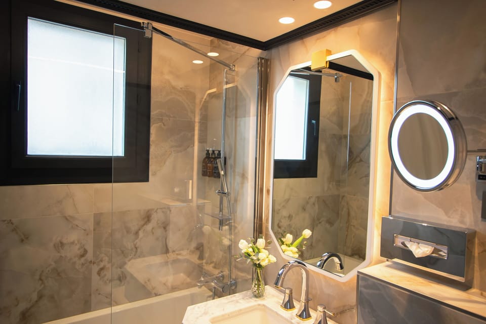 Executive Room With Eiffel Tower View Terrace | Bathroom | Shower, designer toiletries, hair dryer, slippers
