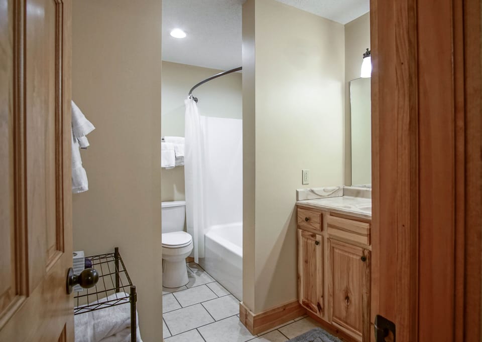 This is the master bathroom. It has a tub/shower combo.