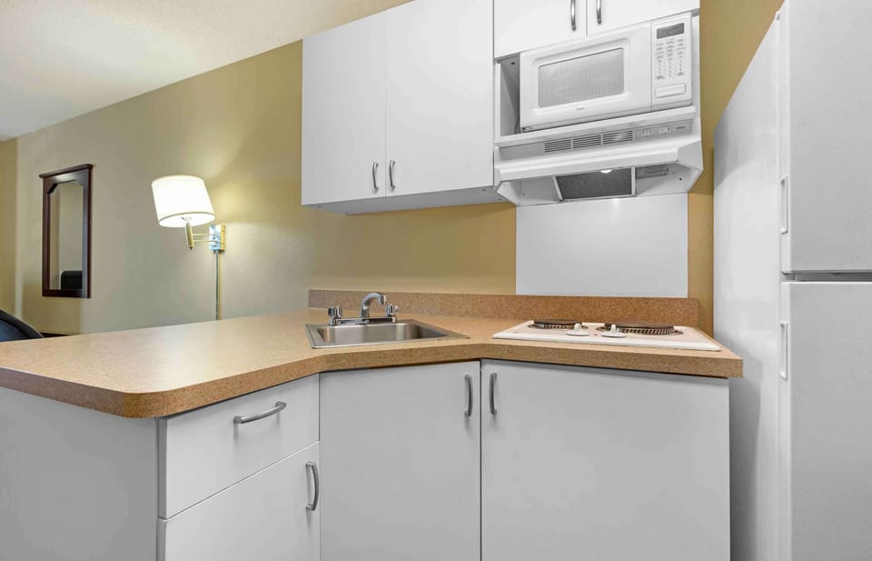 Fridge, microwave, stovetop, coffee/tea maker