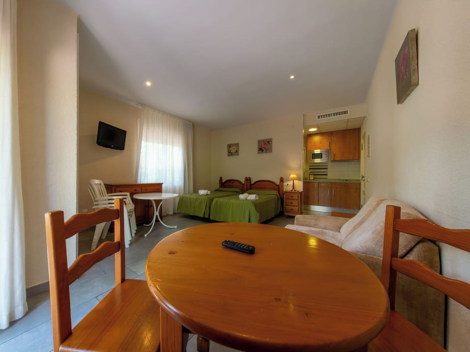 Standard Studio | Living area | 30-inch TV with satellite channels
