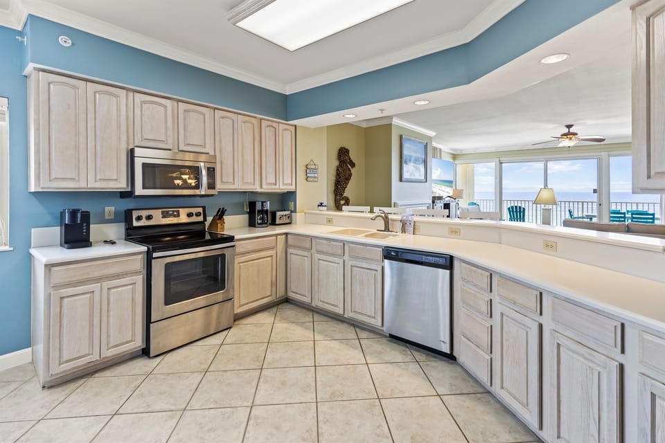 Cook your favorite meals in this spacious kitchen while enjoying stunning ocean views through the living room windows.