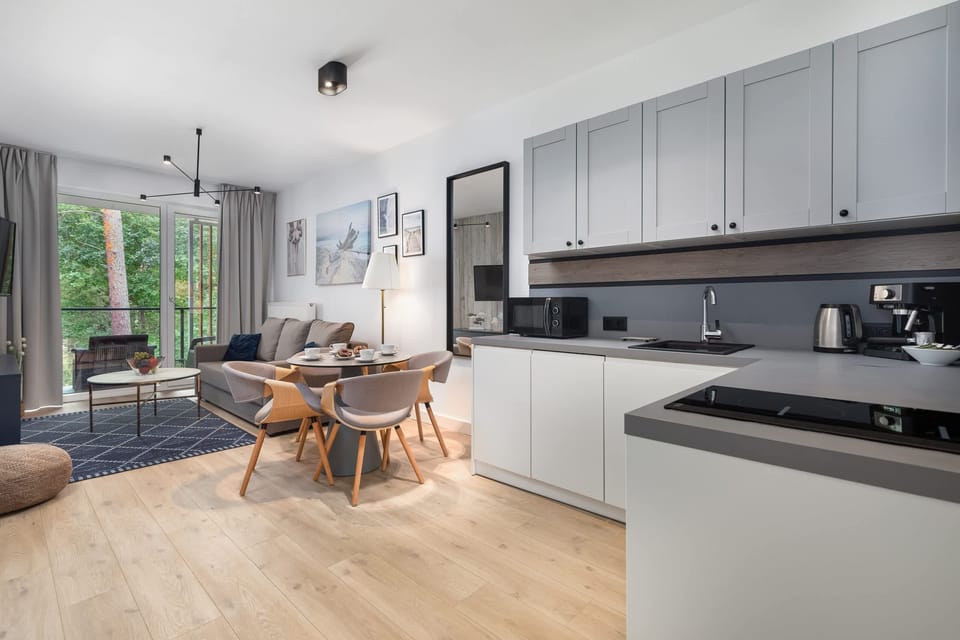 Kitchenette with plenty of kitchen utensils and dishes. 
