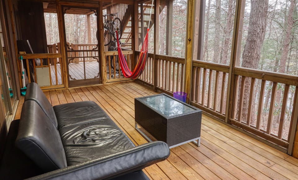 Downstairs waterproof screened deck w/ couch, (2 chairs & 2 tables not pictured