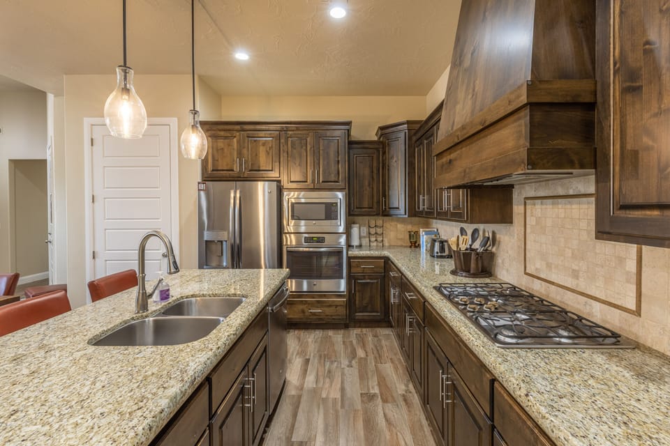 Side View of Kitchen - Side view of kitchen showing off the beautiful counter tops and stainless-steel appliances.