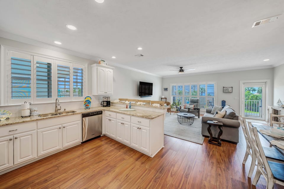 The fully equipped kitchen features granite countertops and stainless-steel appliances and has everything you need to prepare meals for family & friends.