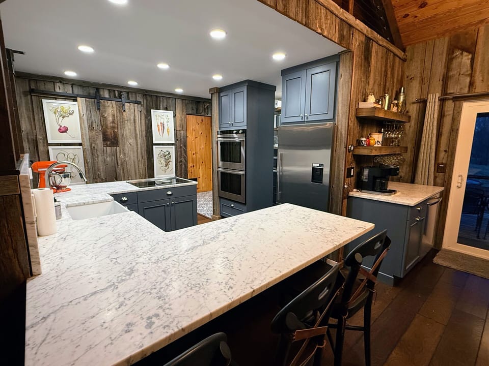 Chef's kitchen with marble countertops