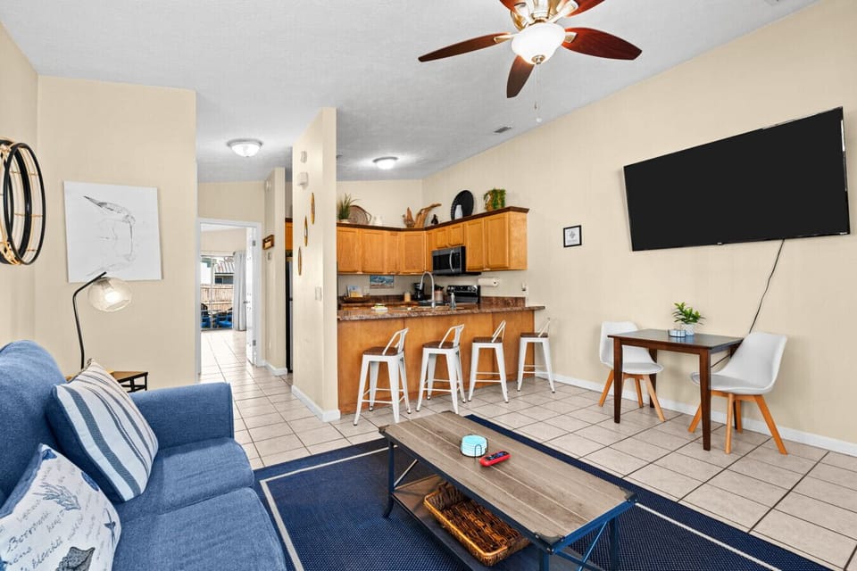 Living room with a 65` 4k HD Roku smart tv!