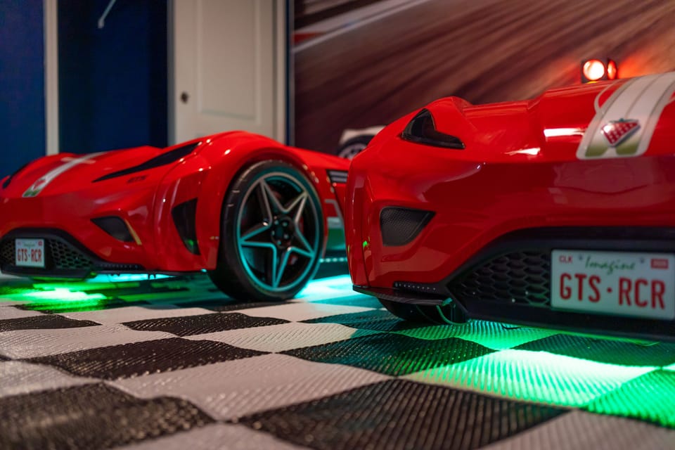 These twin car beds light up and zroom!