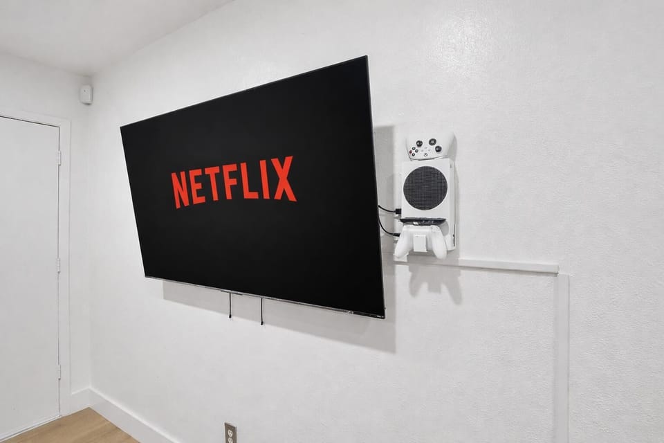 Living room Smart TV with Xbox console—perfect for streaming, gaming, and relaxing indoors.