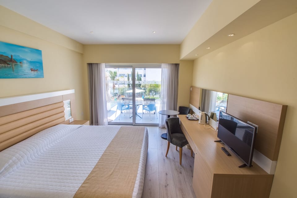 Superior Room, Pool View | In-room safe, desk, laptop workspace, soundproofing