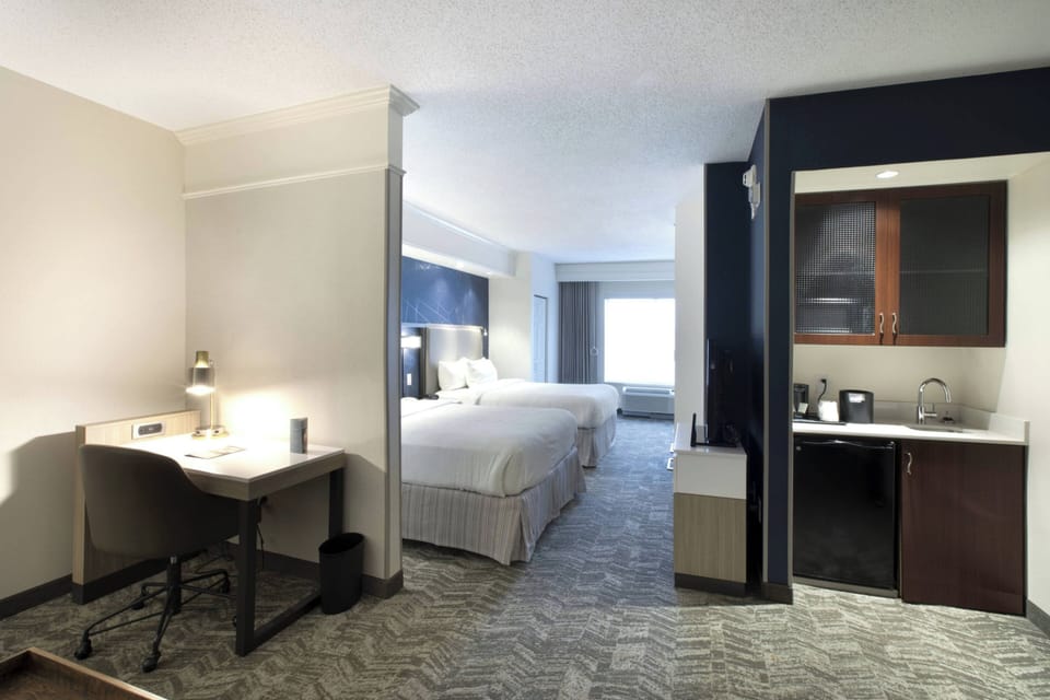 Down comforters, pillowtop beds, in-room safe, desk