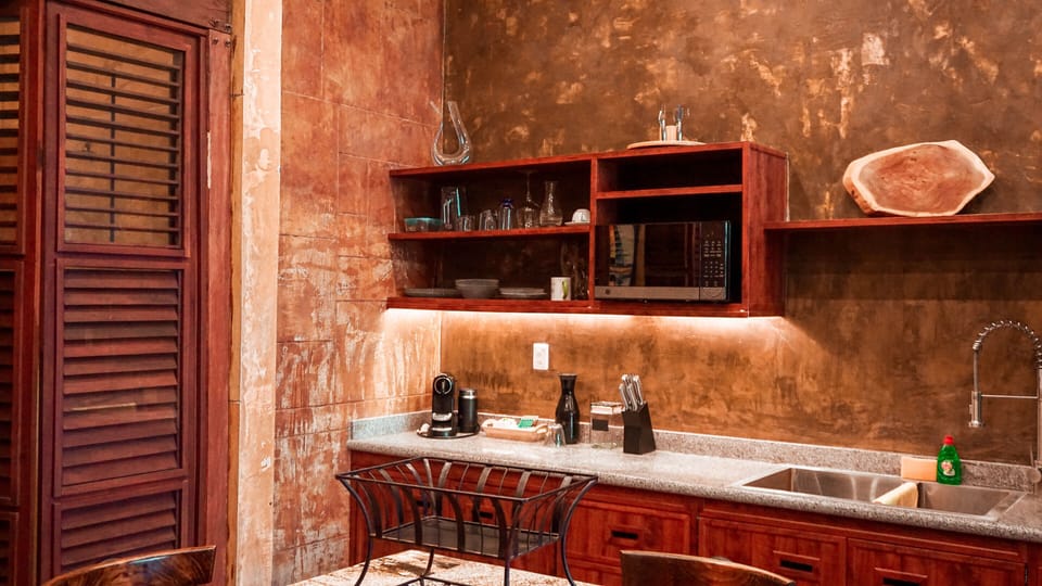 Superior Studio Suite, Partial Ocean View | Private kitchen | Espresso maker, cleaning supplies, dining tables