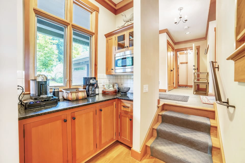 Kitchen alcove, coffee bar, and cupboards 