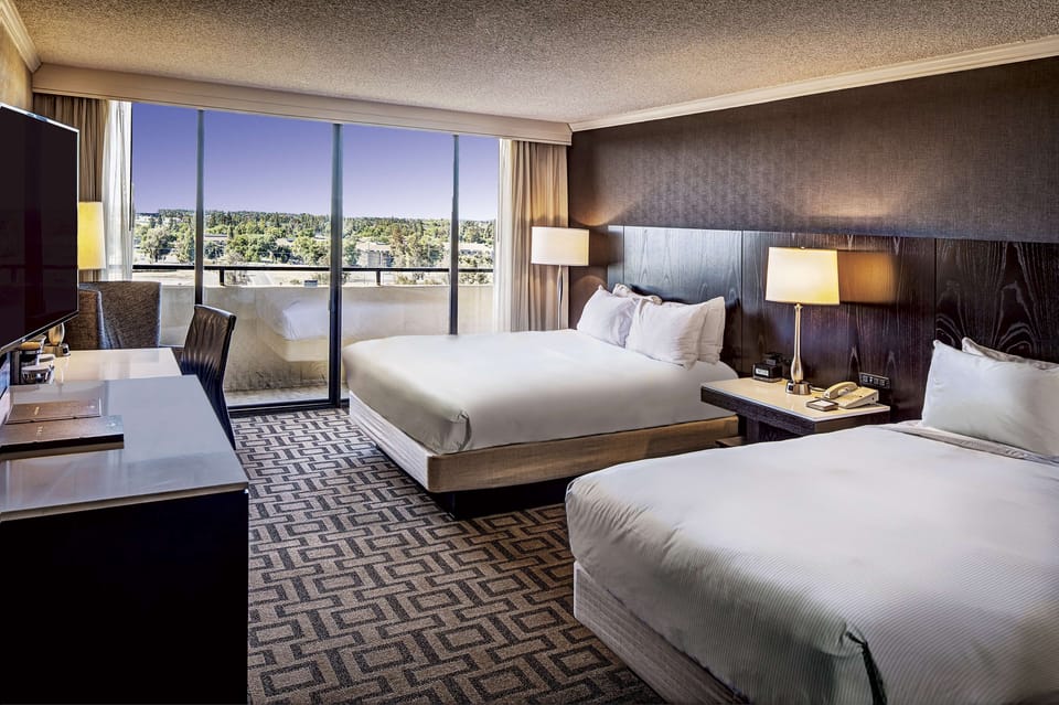 Hypo-allergenic bedding, down comforters, pillowtop beds, in-room safe