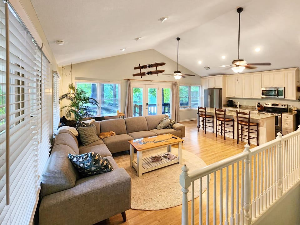 Main living room with island kitchen and full views of our cove.  