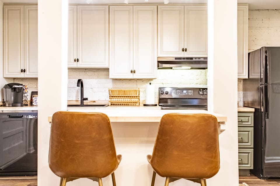 The ground level kitchen features a counter dining area