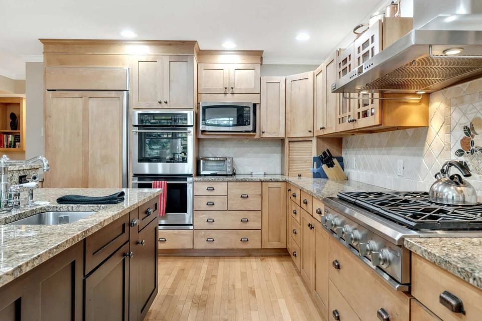 Professional-grade appliances: double wall oven, microwave, and 6-burner gas range