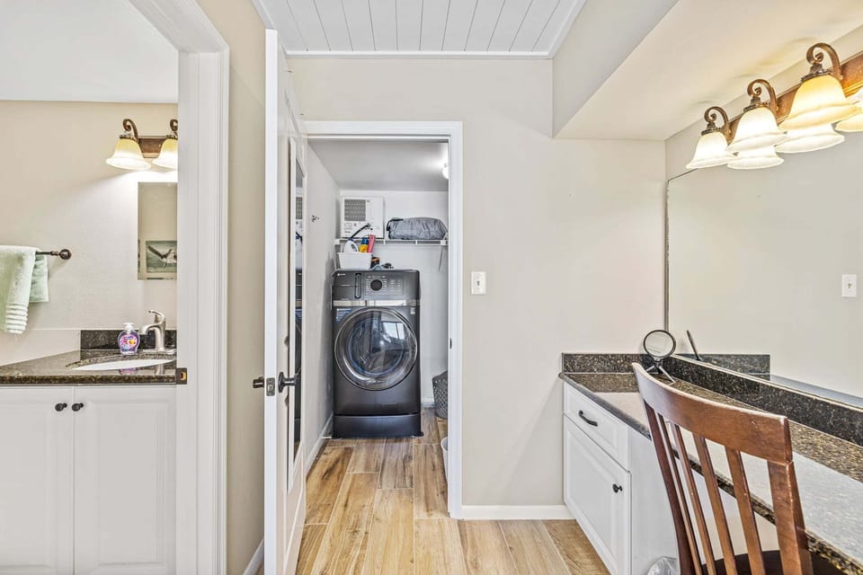 Vanity space connected to the bathroom and laundry.