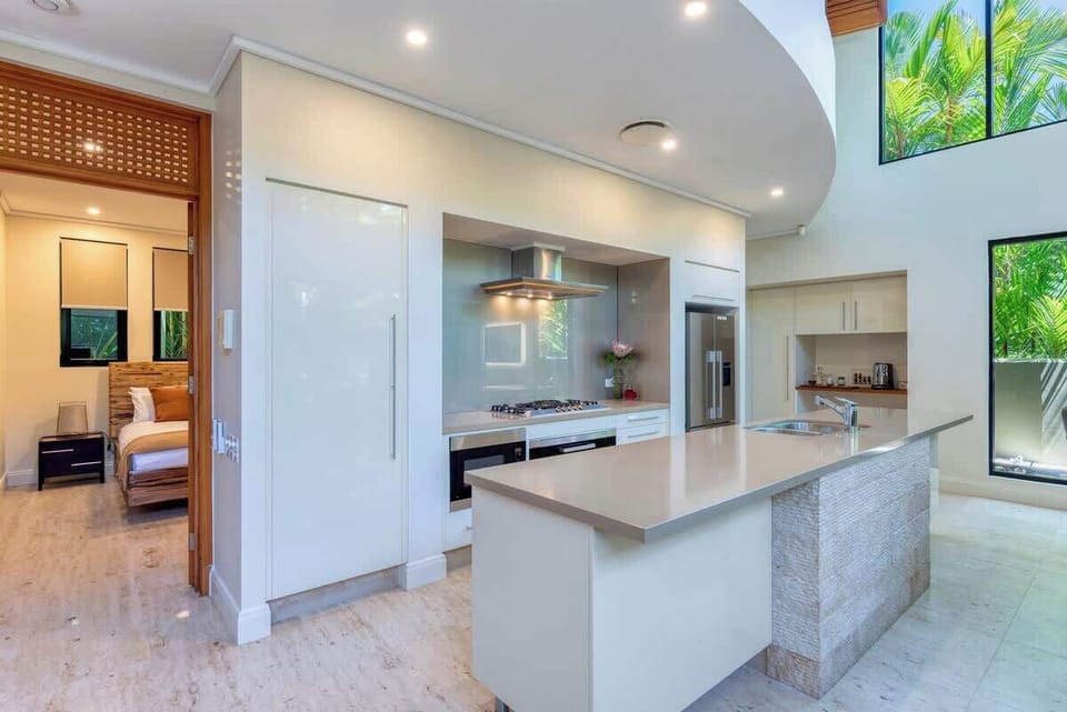 The kitchen is well-equipped for your holiday catering with Miele appliances and stone bench tops.