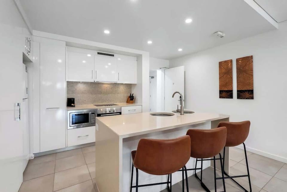 The kitchen’s island bench doubles as a casual breakfast bar, perfect for easy mornings.