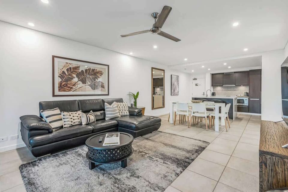 Relax in air-conditioned comfort in the comfortable living area with a leather sofa and a wide-screen TV for everyone to enjoy.
