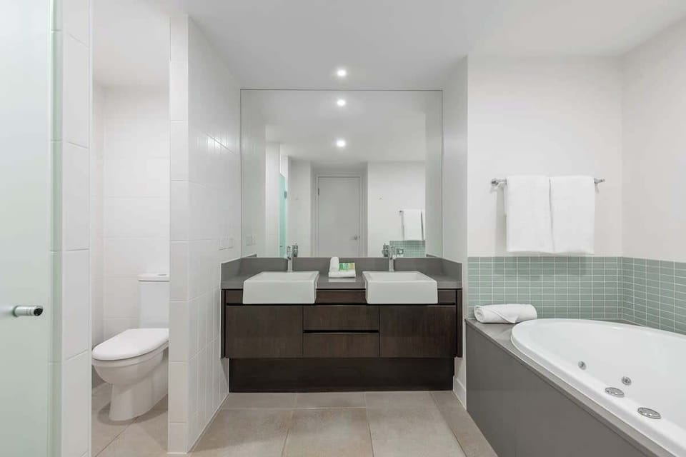 Refresh in style in the primary ensuite, featuring an inviting tub for your ultimate comfort.
