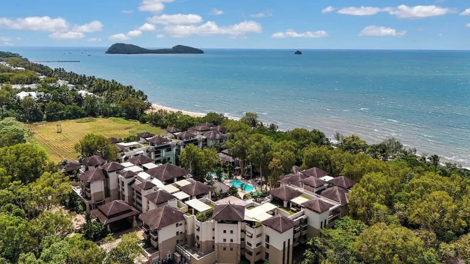 Set against a backdrop of lush greenery, this beachfront resort features an expansive pool area and offers the ultimate escape—just steps away from the shoreline.
