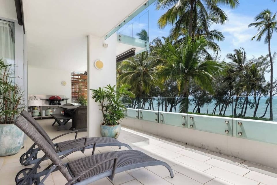 Sun loungers are available on the private balcony overlooking the palm-fringed beach