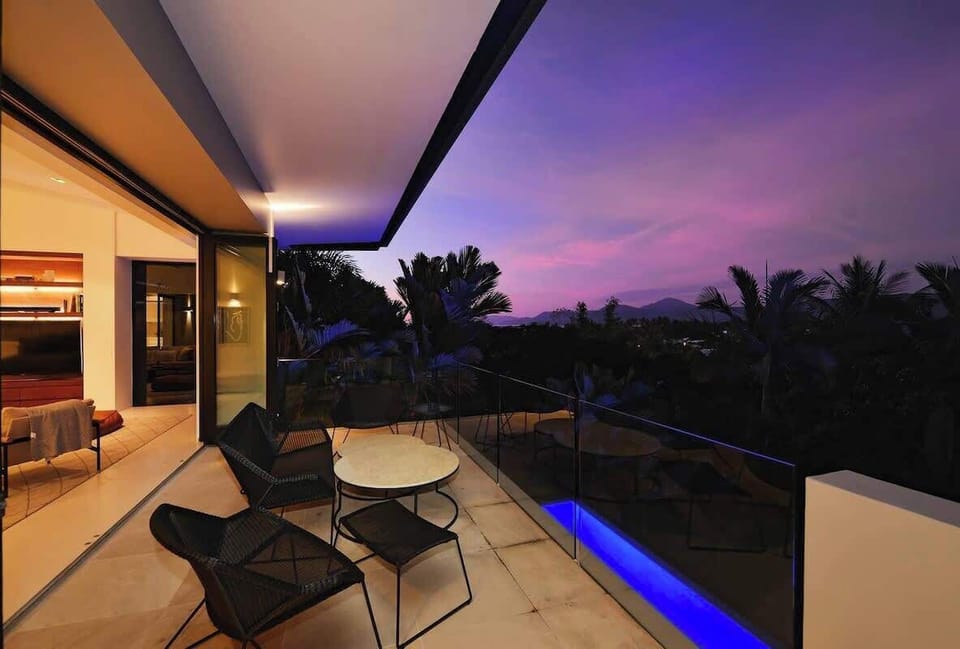 The upstairs balcony offers treetop views overlooking your private pool.