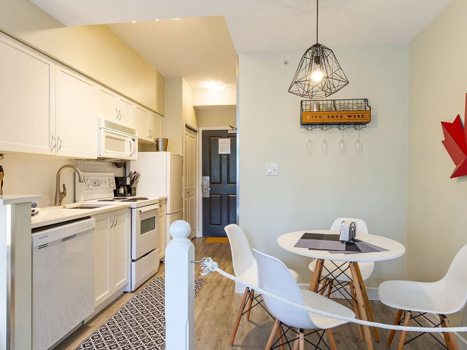 Full kitchen with separate dining space, D/W, fridge and stove/oven