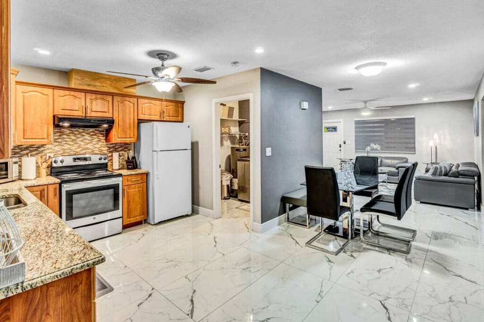 Stainless steel, sleek countertops, and good vibes - this kitchen is ready to cook up something delicious (and maybe a little bit fancy).