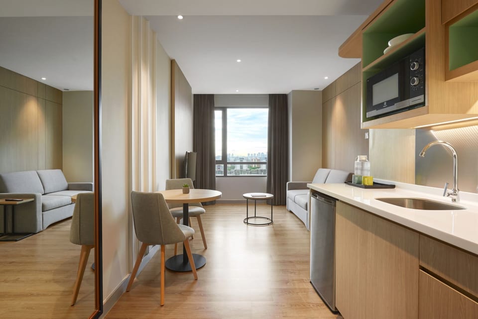 Two Bedroom Deluxe | Living area | 42-inch Smart TV with satellite channels, TV