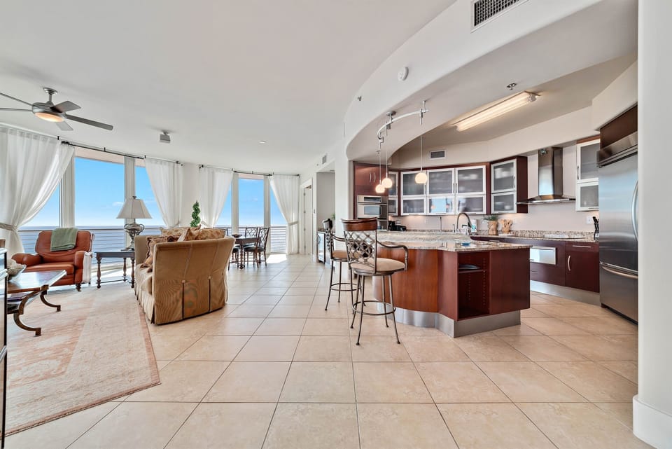 Imagine yourself in this high-end luxury condo, where the open layout flows effortlessly from the well-equipped kitchen to the spacious living and dining areas, all while being just a stroll away from Flora-Bama.