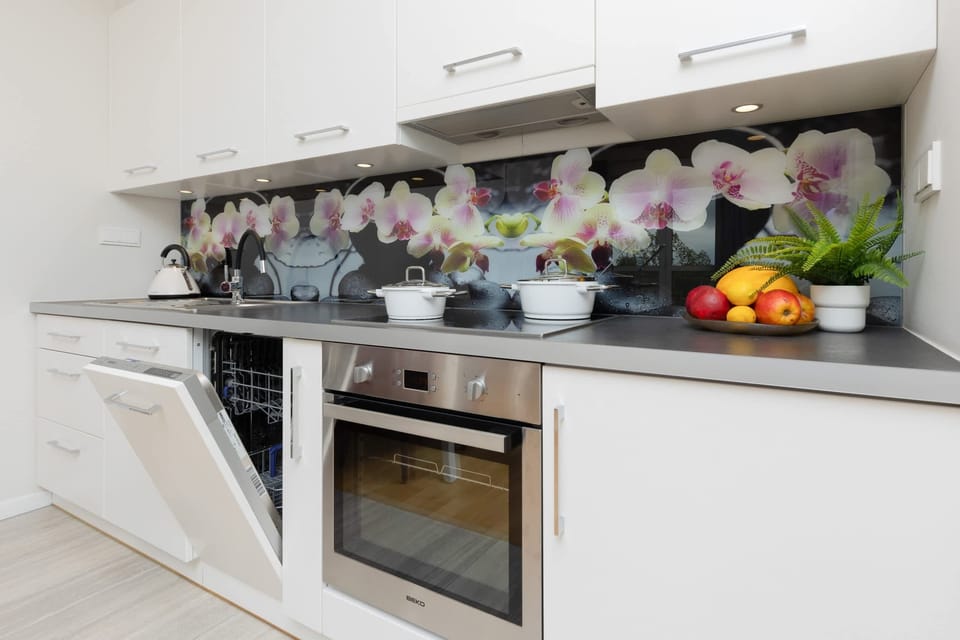 Kitchenette with oven and refrigerator. 