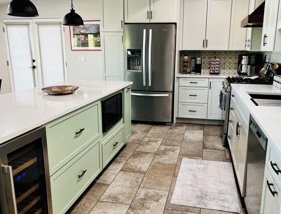 Dishwasher, Gas Stove/Oven, Large Refrigerator, Wine Fridge.