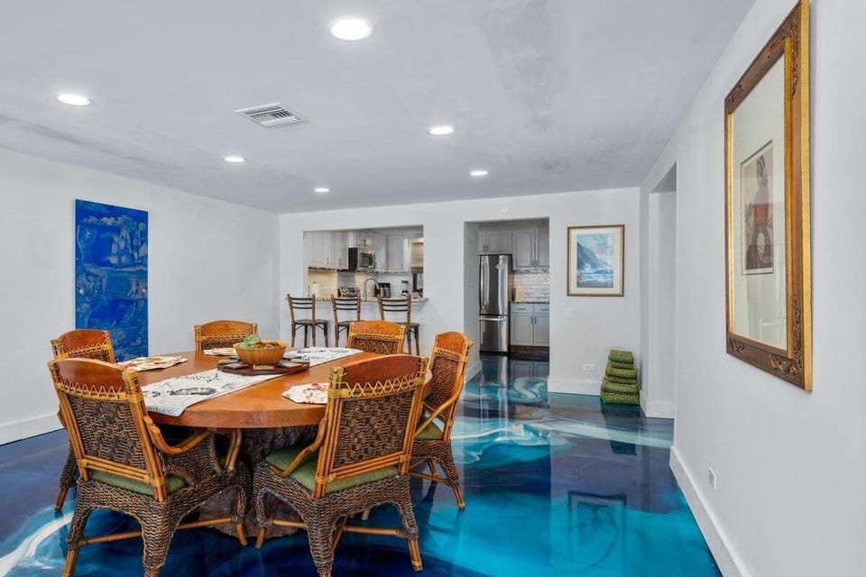 Spacious dining room featuring a beautiful woodcrafter table — perfect for meals or entertaining.