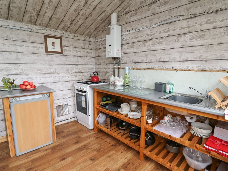 Fridge, electric kettle, cookware/dishes/utensils