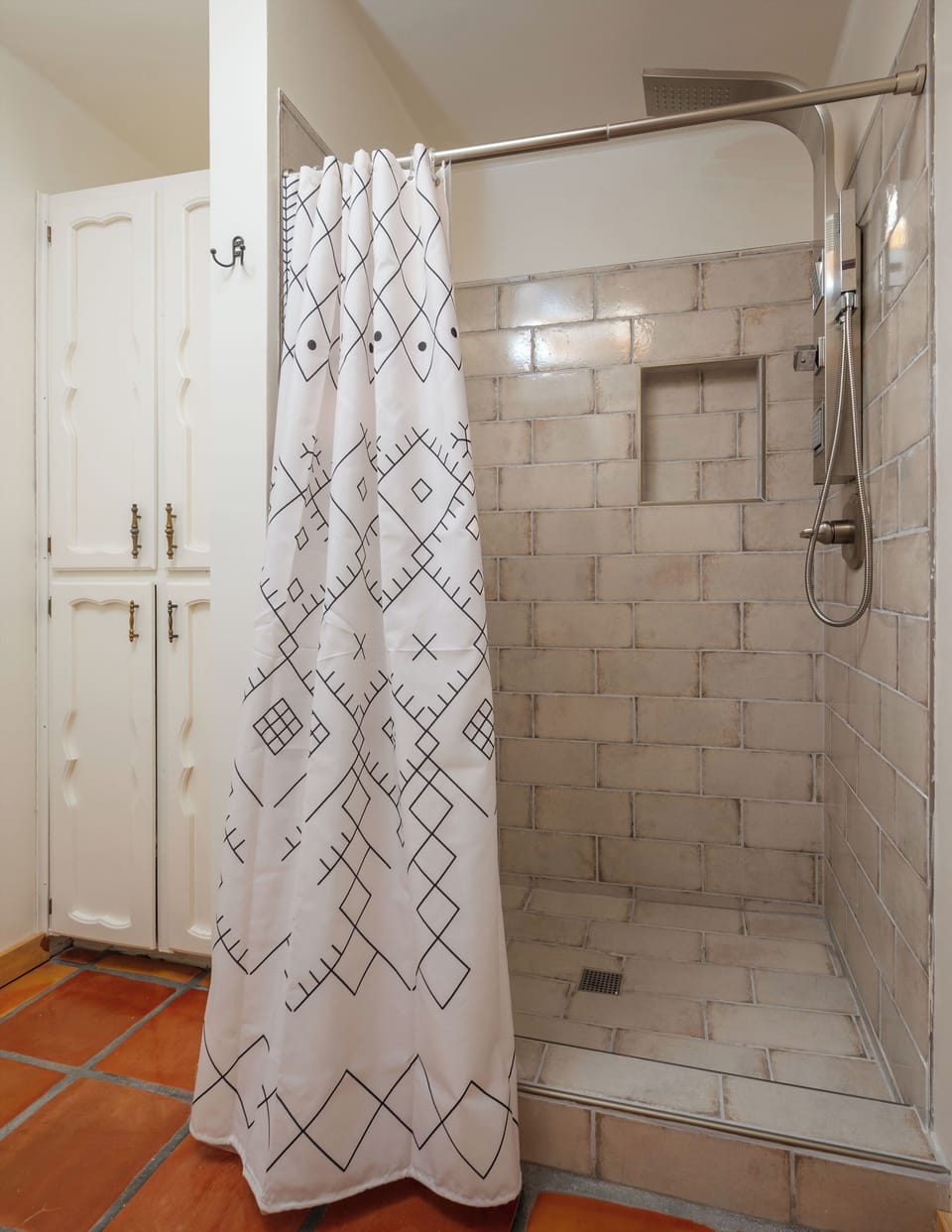 Master shower with rainfall showerhead, wand and body options.