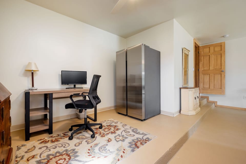 The Study, found in the upper game room, with work area/desk and extra fridge!