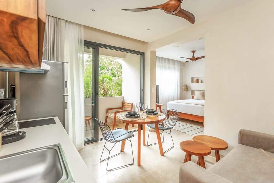 A nice kitchenette & private balcony access & bedroom.