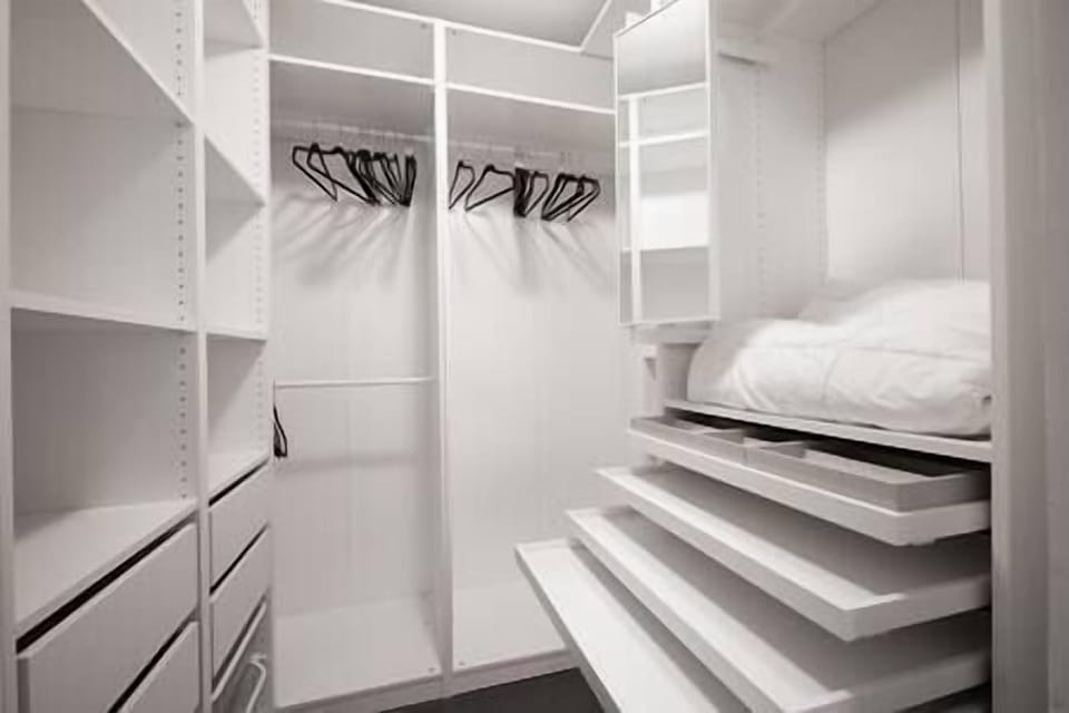 Spacious custom closet system with lots of storage spaces