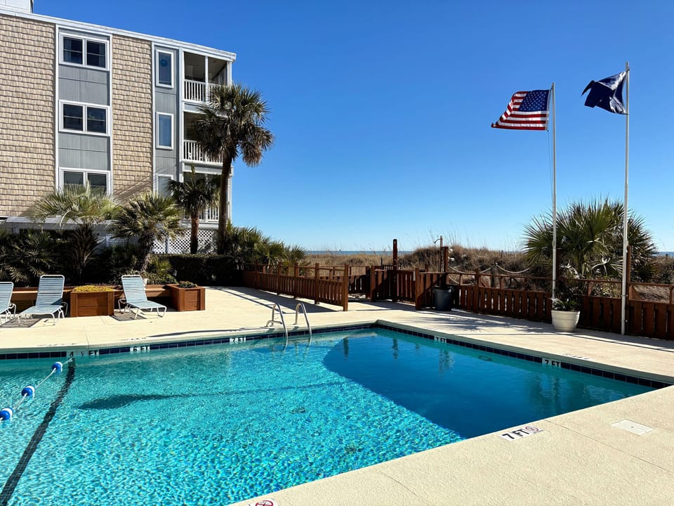 Oceanfront pool days, shoreline strolls, repeat.  (That first level unit is #110)