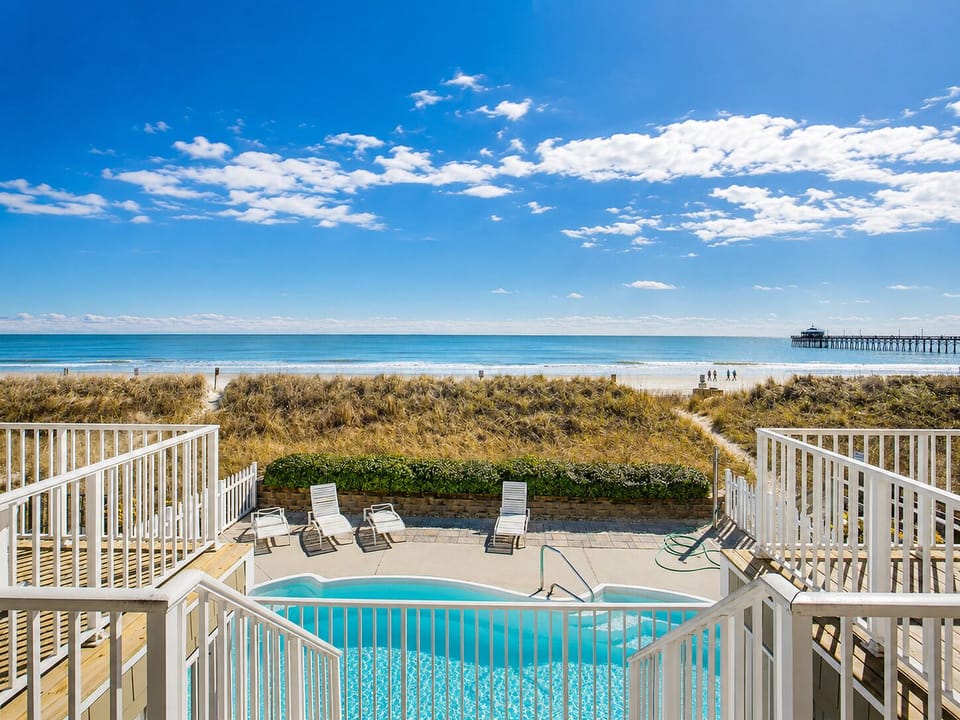 Private oceanfront pool with sundeck seating
