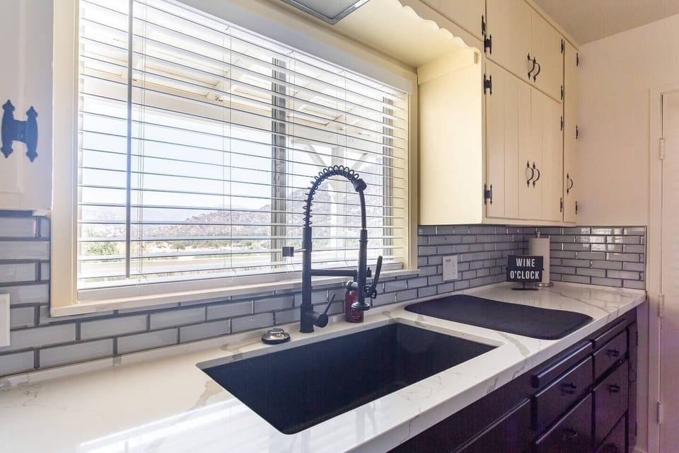 Farmhouse sink with industrial faucet