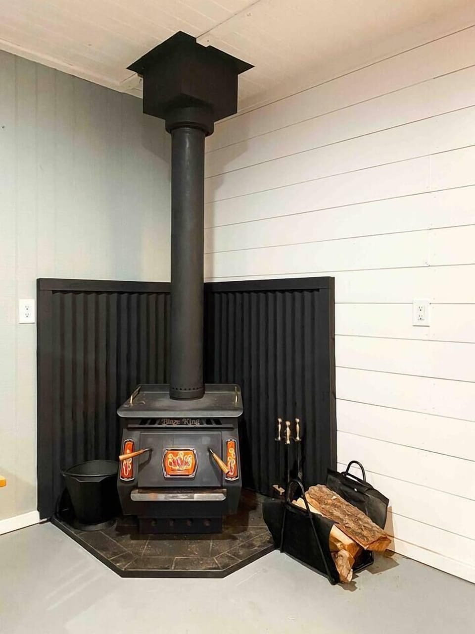 Wood burning stove in game-room to keep warm while your shooting pool and playing games.  